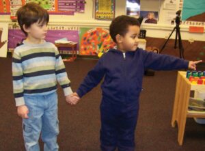 Boy taking his friend's hand