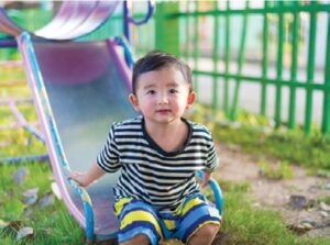 Boy at the Bottom of a Slide