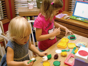 Children sculpting with play dough