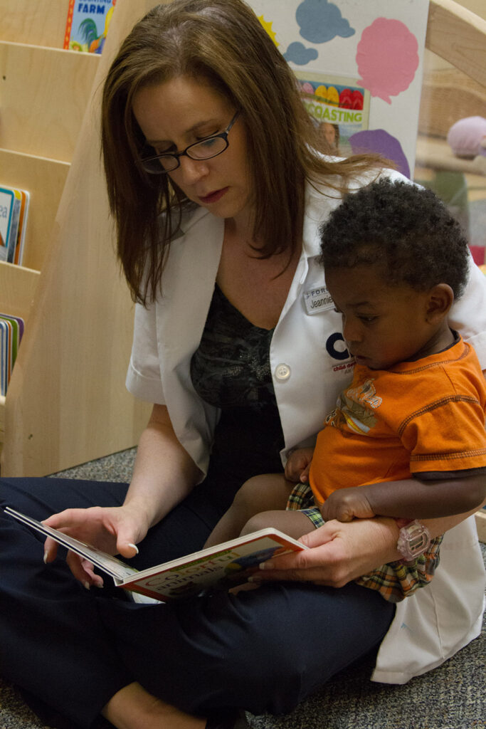 teacher-reading-with-young-student