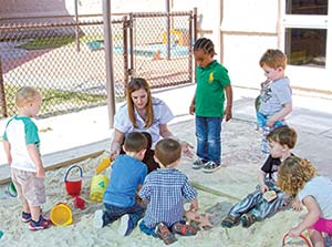 children playing in sand box