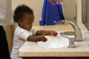 toddler washing hands