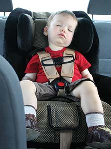 Picture of a child asleep in a car seat