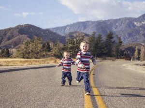 Children running in street