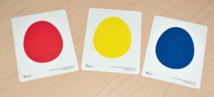 three cards showing different colors of eggs