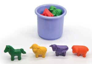 Farm animal counters in a line and in a cup