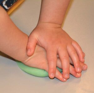 flattening play dough