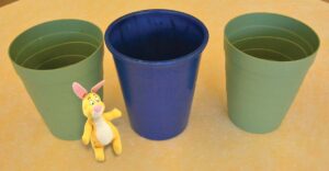 bunny next to upright flowerpots