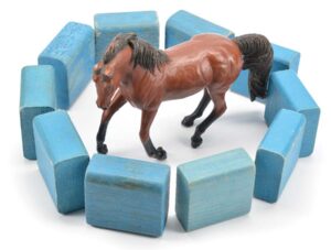 horse in a blue block barn