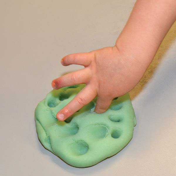 poking holes in play dough